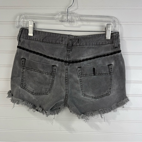 Free People women’s faded gray & black cutoff distressed denim shorts. Size 24 - Picture 2 of 8